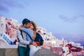 Valentine`s day in Oia. Couple in love enjoying honeymoon on Santorini island Greece at sunset. Vacation and traveling Royalty Free Stock Photo