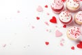 Valentine's Day party with heart-shaped decorations, confetti, and cupcakes Royalty Free Stock Photo