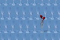 Valentine`s day pattern. Copy image of an empty champagne glass on a light blue background. Royalty Free Stock Photo