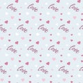 Seamless Valentine s pattern with cursive love text and scattered pink Royalty Free Stock Photo