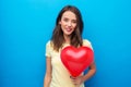 Teenage girl with red heart-shaped balloon Royalty Free Stock Photo