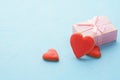 Valentines Day. Pink gift box and red heart shaped cookies. Royalty Free Stock Photo