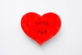 Valentine`s day postcard in the form of a scarlet heart with the inscription love you