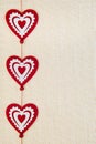 Valentine`s day, postcard, restaurant menu, natural linen background, burlap, Three red hearts with white ornament, high quality, Royalty Free Stock Photo