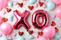 Valentine's day poster with shiny foil balloons XO kiss and hug message