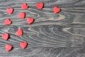 Valentine`s Day . Red hearts on a wooden background.