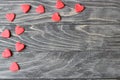 Valentine`s Day . Red hearts on a wooden background.
