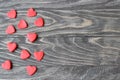Valentine`s Day Red hearts on a wooden background.