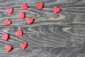 Valentine`s Day . Red hearts on a wooden background.