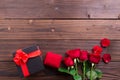 Valentine's Day: red roses, gold ring and box gift