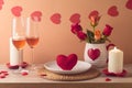 Valentine\'s day romantic dinner concept. Wooden table with plate, heart shape, wine, flowers and candles over peach color