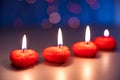 Valentine`s Day, a romantic still life of burning candles from hearts laid out on a blurred background, bokeh effect Royalty Free Stock Photo