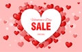 Valentine s day sale banner. White heart on a background of red bubble hearts