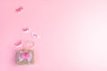 Valentine`s day sale concept. Decorative wicker handbag and hearts with discount percentages on pink backdrop