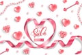 Valentine`s Day sale web banner. Top view on composition with pink glittering hearts, pink pearls, heart pink ribbon