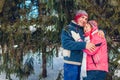 Valentine`s Day. Senior family couple hugging in winter forest. Happy man and woman walking outdoors Royalty Free Stock Photo