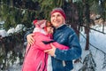 Valentine`s Day. Senior family couple hugging in winter forest. Happy man and woman walking outdoors Royalty Free Stock Photo