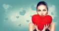 Valentine`s day. girl with heart shaped fluffy red pillow Royalty Free Stock Photo