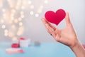 Valentine& x27;s Day symbol of love heart shape in hands, bokeh Royalty Free Stock Photo