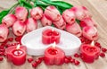 Valentine`s Day Tulips, a heart-shaped plate and a heart-shaped candle. Royalty Free Stock Photo