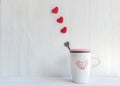Valentine`s Day with white cup coffee red heart row on the cup, Royalty Free Stock Photo