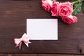 Valentine`s Day: White empty paper card and roses petals Royalty Free Stock Photo