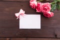 Valentine`s Day: White empty paper card and roses petals Royalty Free Stock Photo