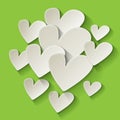 Valentine`s day white paper hearts on a green background. Royalty Free Stock Photo