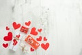 Valentine`s Day. White texture c red hearts on a white background.Flat-lay, top view, copy space Royalty Free Stock Photo