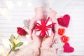 Valentine`s Day. Young couple hands holding gift box over white wooden background. Love concept Royalty Free Stock Photo