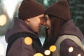 Valentine's day. Young joyful happy people. Young stylish loving couple walking in winter park. Man and woman hugging Royalty Free Stock Photo