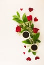 Valentine still life with pearl ring in man hand, red roses and woman hand with coffee Royalty Free Stock Photo