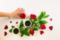 Valentine still life with pearl ring in man hand, red roses and woman hand with coffee Royalty Free Stock Photo