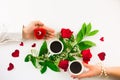 Valentine still life with pearl ring in man hand, red roses and woman hand with coffee Royalty Free Stock Photo