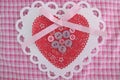 Valentine white and red lace, doily, ribbon, and button heart Royalty Free Stock Photo