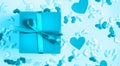 Valentine's Day background. Blue present gift box on Blue background. Royalty Free Stock Photo