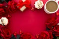 Valentine's day background, red roses, coffee cup, cupcakes, gift box and hearts on red background with copy space Royalty Free Stock Photo