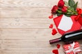 Valentine& x27;s day composition with red wine, rose flower and gift box on table. Top view, flat lay, copy space Royalty Free Stock Photo