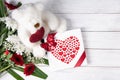 Valentine's day gift, teddy bear with a heart, a box of pralines and a bouquet