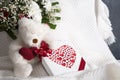Valentine& x27;s day gift, teddy bear with a heart, a box of pralines and a bouquet