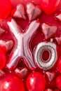 Valentine's day poster with shiny foil balloons XO kiss and hug message