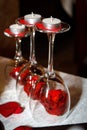 Romantic Valentines day decoration three wineglasses with candles and red roses