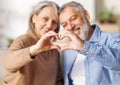 Valentine's Day for Seniors. Happy elderly family couple in love make heart sign with hands Royalty Free Stock Photo