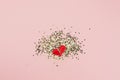 Valentines abstract Top view of golden stars confetti red heart in two pieces with copy space millennial pink color paper