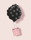 Valentines black hearts balloon with gift box postcard on pale pink background. Love and holiday symbols for Happy Women`s, Mothe Royalty Free Stock Photo