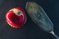 Valentines cake with heart shape with metal fork on black backgrount, produkt photography for patisserie