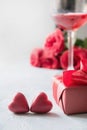 Valentines card with red gift box, roses, champagne bottle on white. Space for text Royalty Free Stock Photo