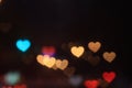 Valentines Colorful heart-shaped on black background lighting bokeh for decoration at night backdrop wallpaper blurred valentine