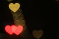Valentines Colorful heart-shaped on black background lighting bokeh for decoration at night backdrop wallpaper blurred valentine