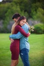 Valentines couple with gift of flowers,